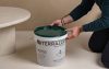 Professional applying Terrazzo GraniTech anti-crack plaster system to prevent plaster cracking on walls with advanced resin technology